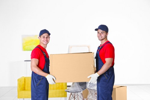 Professional movers loading furniture into a van for a Hackney Marshes relocation