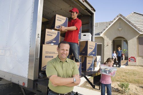 Man with van service loading household items into a vehicle