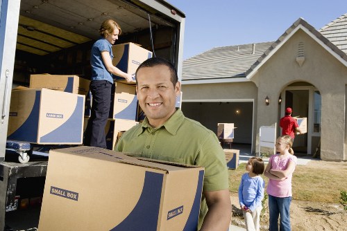 Checklist and packed moving boxes for a local removal service
