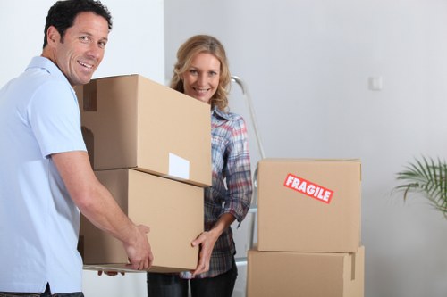 Moving crew handling items carefully in a Hackney Marshes property