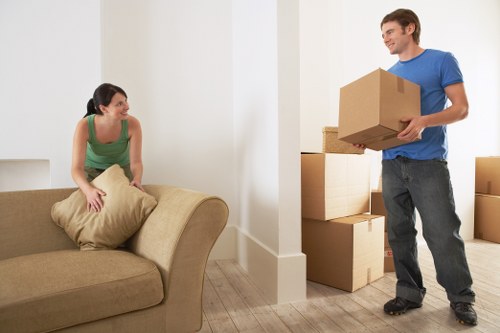 Local packing team preparing fragile household items for a move in Hackney Marshes
