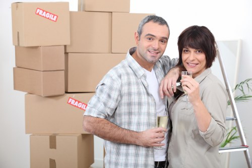 Local removals team handling boxes and household items in East London